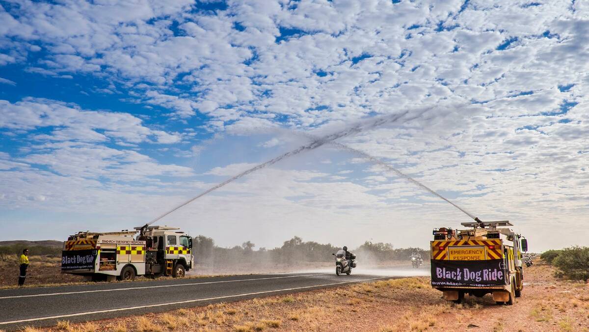 Black Dog Ride was established in 2009 by WA businessman Steve Andrews. He rode his motorcycle solo around Australia in 26 days to raise awareness of depression. Photo: Roger Clark. 