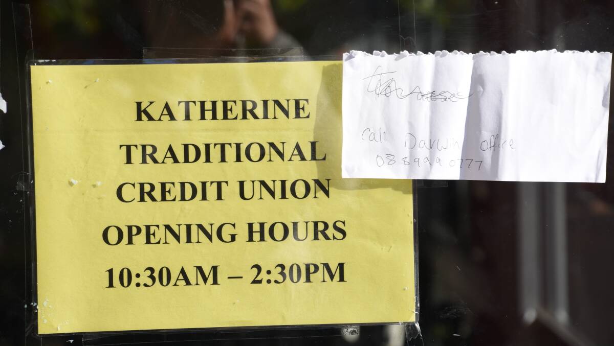 The only indication of closure is this handwritten sign taped to the entrance of Traditional Credit Union in Katherine. 