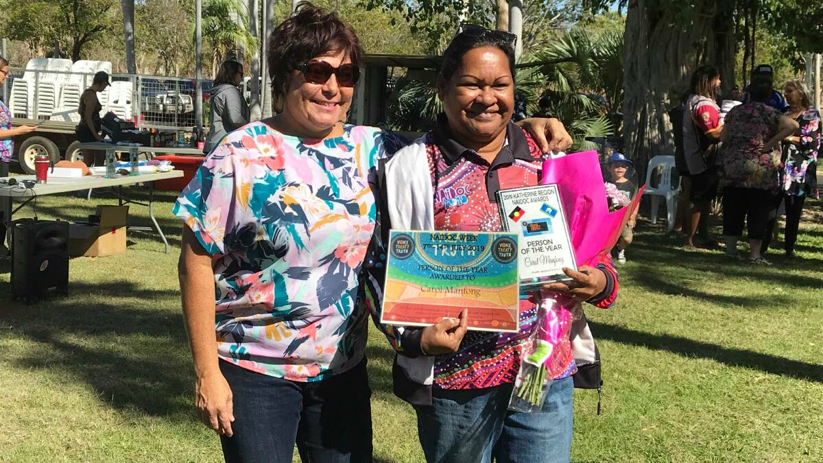 Katherine Naidoc Committee member Maddy Bower stands with 2019 Naidoc person of the year, Carol Manfong, at the awards ceremony on Sunday. Picture: Lee Fisher. 