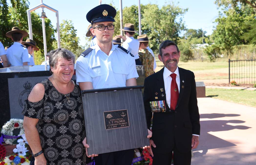Ray and Pam Palmer stand with the dedicated plaque remembering their son Scott Palmer who was tragically killed in Afghanistan, 2010. 