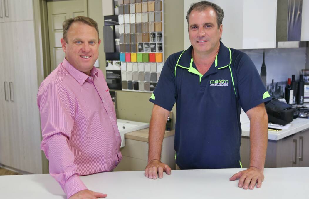 WINNING BID: Lendlease chief executive officer (building) Dale Connor with Custom Cabinets Katherine owner Jeff Usher. Picture: supplied.