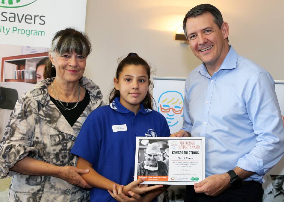 TOP AWARD: Founding Director of The Fred Hollows Foundation, Gabi Hollows, with Fred Hollows Humanity Award recipient Darci Place, from Clyde Fenton Primary School, and Chief Minister Michael Gunner. Picture: supplied.