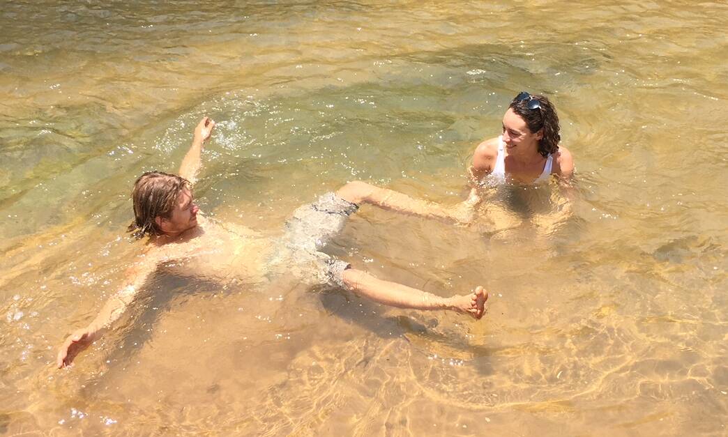RISKY BUSINESS: Despite the croc warnings, visitors Emily and Shane were swimming in the Katherine River today.