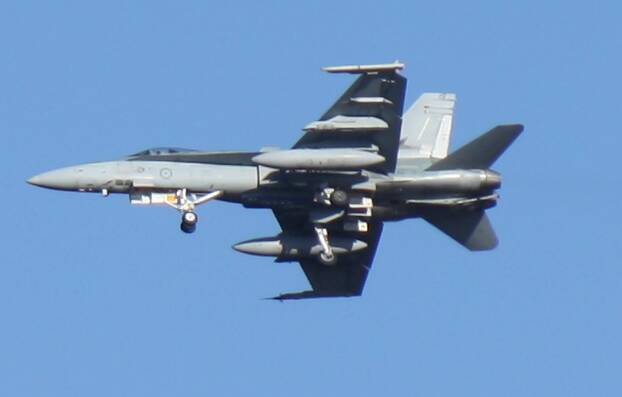 EXERCISING: One of a flight of F/A-18 Hornets comes in to land at Tindal RAAF Base last week.