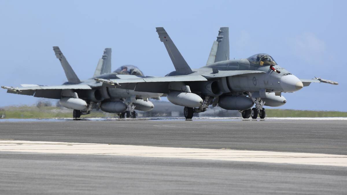 TOUCH DOWN: F/A-18A Hornets from the Tindal RAAF Base's 75 Squadron arrive at Andersen Air Force Base, Guam for Exercise Cope North. Picture: Defence Media.