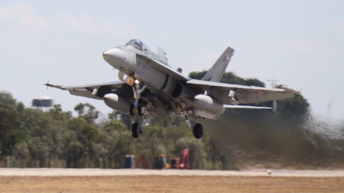 FUEL BURNER: A FA/18 Hornet takes off from the Tindal RAAF Base today.