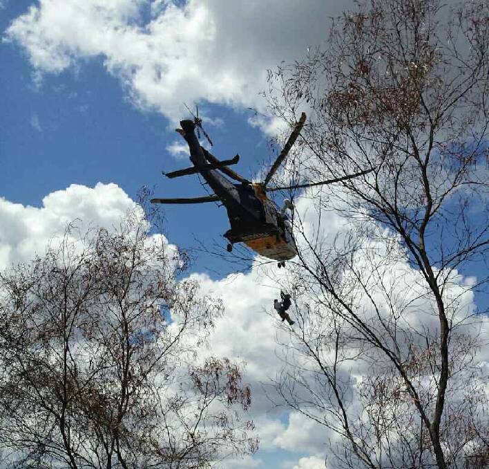 A bushwalker is winched to safety. Picture: CareFlight.