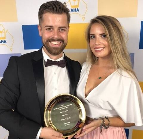 WINNERS: Cicada Lodge guest services manager Charlie Gourlay and Lauren Nurse, reservations attendant Nitmiluk Tours, accept the Gold Plate Award at Sky City event in Darwin last night. Picture: supplied.