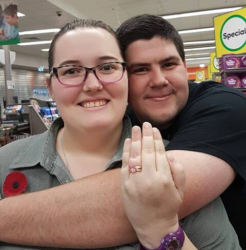 SUCCESS: Katy looks pleased with her new engagement ring, and Chris, well he just looks pleased. Picture: supplied.