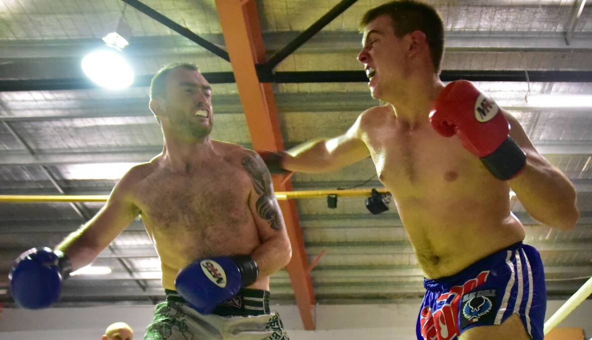 Haymaker: Blue Eagle competitor Jack Harris up against Dermit Harrington in the Muay Thai ring in Darwin on the weekend. Photo: Craig Radcliffe Sports Photography.