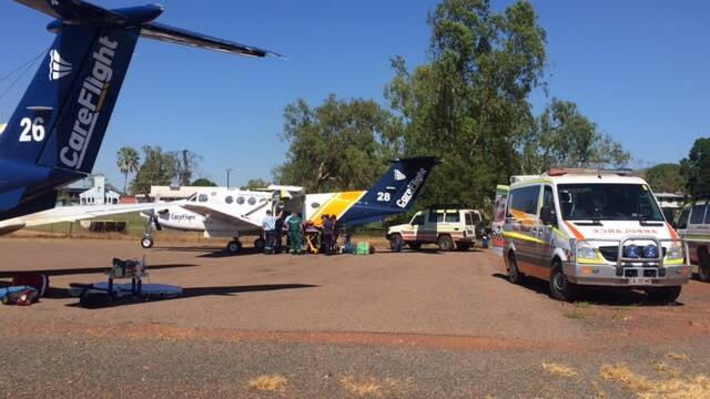 Health teams at the Daly River airstrip prepare to fly patients to Darwin on CareFlight King Air turbo-prop aircraft.