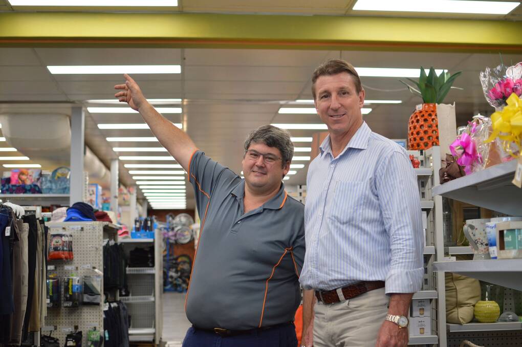 BRIGHT IDEA: Craig Lambert shows Member for Katherine Willem Westra van Holthe how the  Smarter Business Solutions program has led to brighter outcomes at his Katherine Terrace business through the installation of LED lighting.