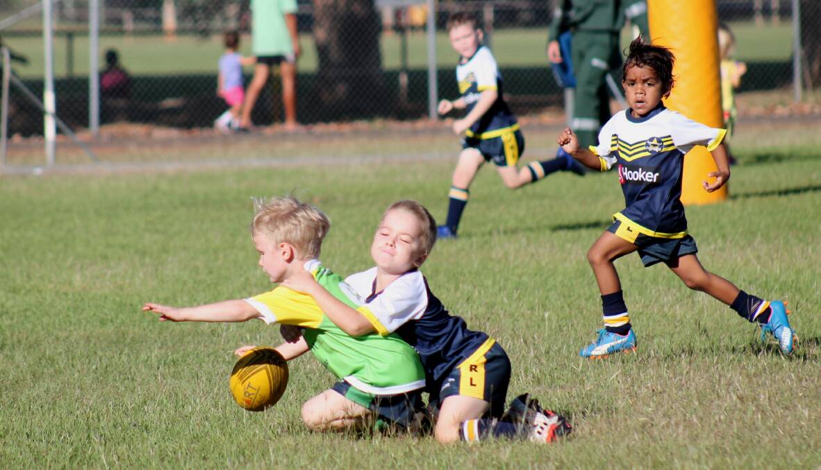 OUT OF OPTIONS: Mitchell Brown is brought to the ground by Darcy McWhirter in a try-saving tackle as the Katherine Junior Rugby League's under-6 Cowboys and Raiders teams show off their skill on Sunday morning.