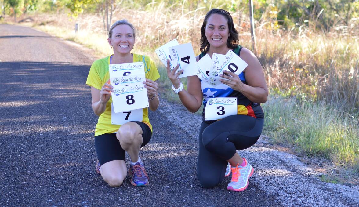 RIVER READY: Penny Wigan and Allirra Ludwig show off the new Katherine Multi Sports Club race bibs competitors will be given for the 2016 Run the River when the starter's gun echoes off the riverbank on June 19.