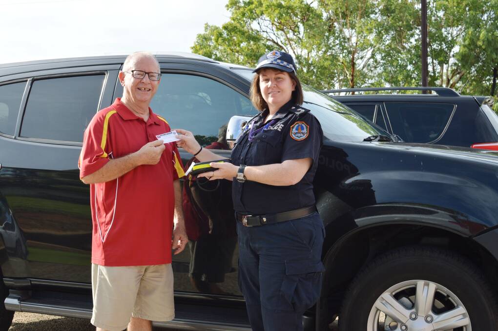 ZERO REWARD: Katherine Community Bank board chair Joe Smith gets his ticket for blowing zero from Acting Superintendent Meghan Funnell as local police prepare to launch the Sober Streets project on Christmas Eve.