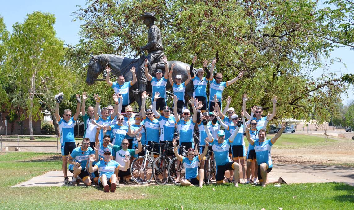 SADDLING UP: Cyclists on the TourXOz get up close and personal with a rider of a different kind - the statue of indigenous horseman Peter Sabu Sing - after arriving in Katherine on World Mental Health Day on October 10.