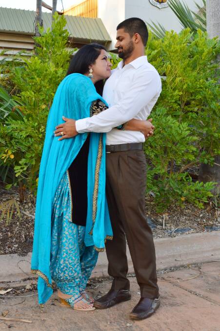 Manpreet Kaur embraces her partner, Sandeep Buttar, to congratulate him after he joined 12 other Katherinites in becoming the town's newest Australians in a ceremony at the Katherine Civic Centre on August 24.