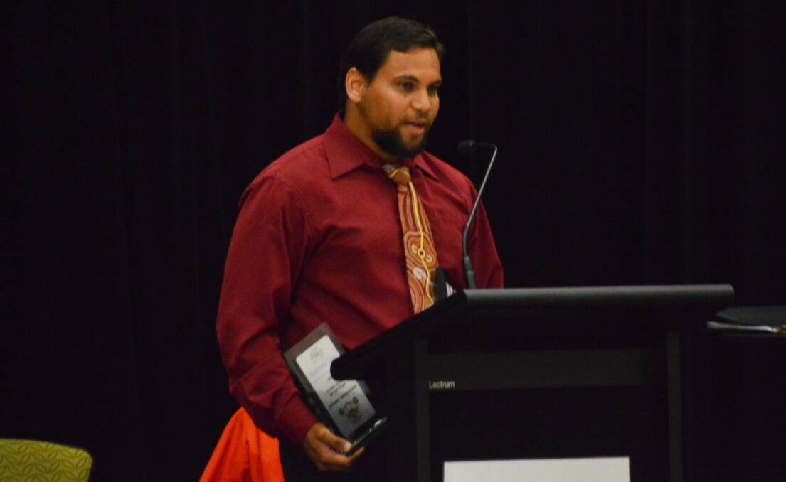 ROLE MODEL: Young Citizen of the Year Anthony Assan-Busch accepts his award on January 26 for his contribution to indigenous education in the Katherine region.
