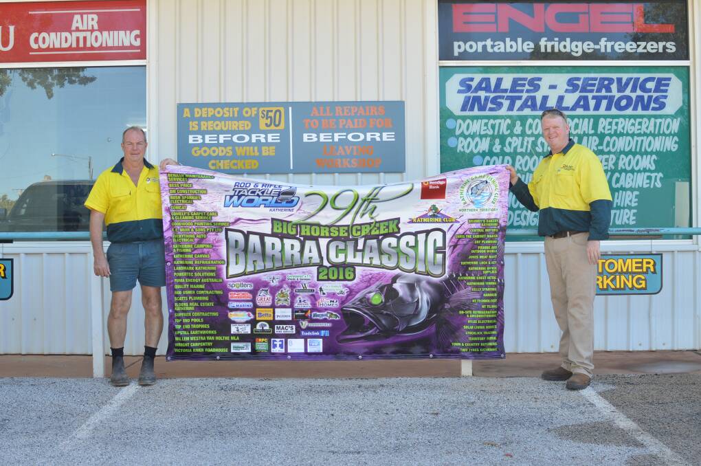 COVETED CATCH: Brian "Blondie" Demarco and Harry Renfree show off the banner that will go under the hammer at the 2016 Big Horse Creek Barra Classic.