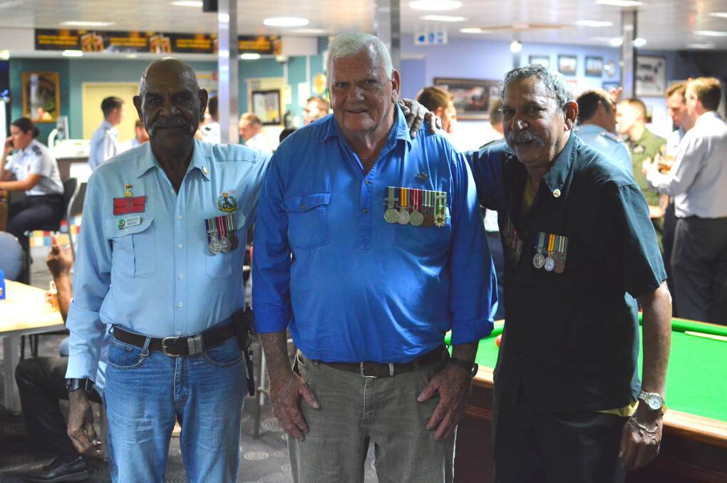 Long-time friends and former service personnel Francis Hayes, Mick Markham and Ali Muir catch up at the Katherine RSL for a beer.