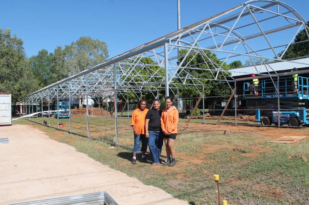 GROWING COMMUNITY: Katherine Indigenous Women's Association vice-chair Kathy Roberts, chair Taryn Kruger and secretary Angie Siputro inspect the progress.