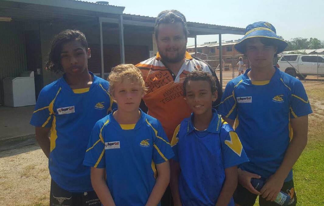 SUCCESS: Katherine touch football players Braithlee Payne, Jace Byers, Tarkyn Rosas and Josh Healy with their coach Lucas after making the NT representative team.