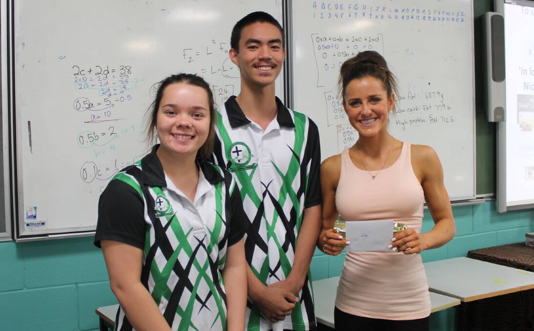 SAFE TRAVELS: St Joseph's Catholic College Katherine school captains Hayley Downes and Michael Edwards thank Kate Fitzsimons for sharing her sister's story with them, as well as those of others injured while travelling overseas.