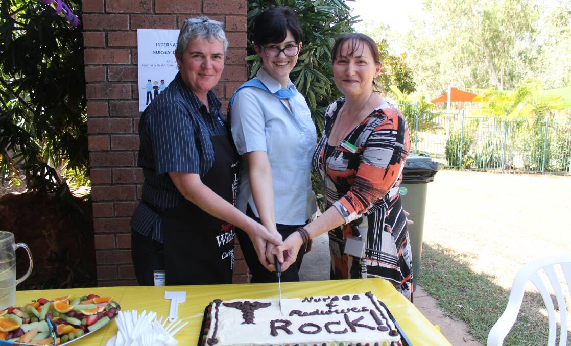 NURSE AND MIDWIFE CELEBRATION: Registered midwife Meg Williams, registered nurse Charis Parks and Katherine region Top End Health Service general manager Angela Brannelly cut the celebratory cake.