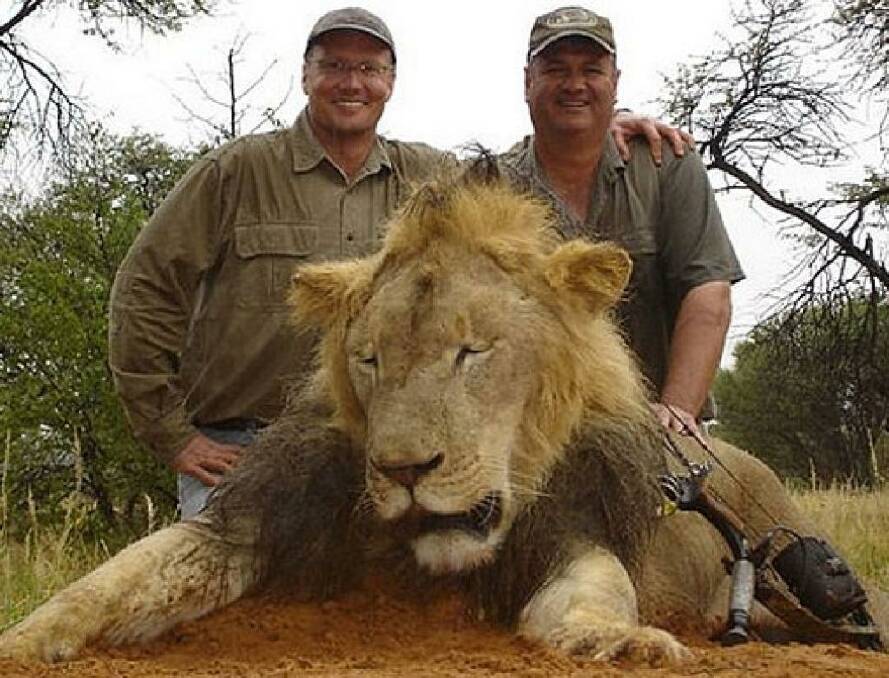 Hunter Walter James Palmer, left, with another lion he killed. Photo: Facebook