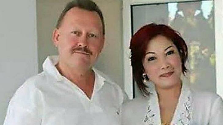 Bob Ellis with his wife Julaikah Noor Aini, who is a prime suspect in his murder.  Photo: Supplied