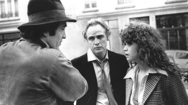 In this 1972 file photo originally provided by United Artists, Director Bernardo Bertolucci, left, Marlon Brando and Maria Schneider are shown during the filing of <em>Last Tango in Paris</em>. Photo: AP Photo/United Artists