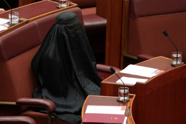 Senator Pauline Hanson wears a burqa during question time at Parliament House in Canberra on Thursday 17 August 2017. Fedpol. Photo: Andrew Meares 