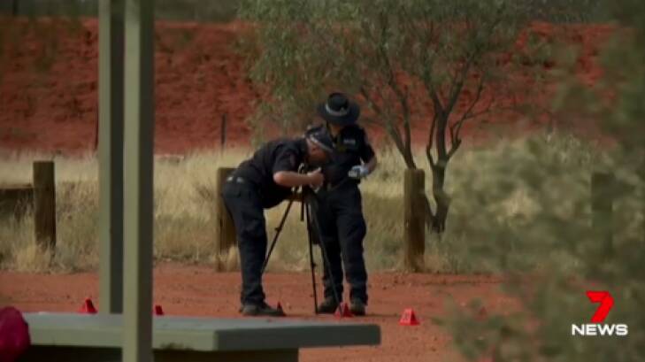 Police investigate at the scene of a stabbing death in the Northern Territory.  Photo: Seven News