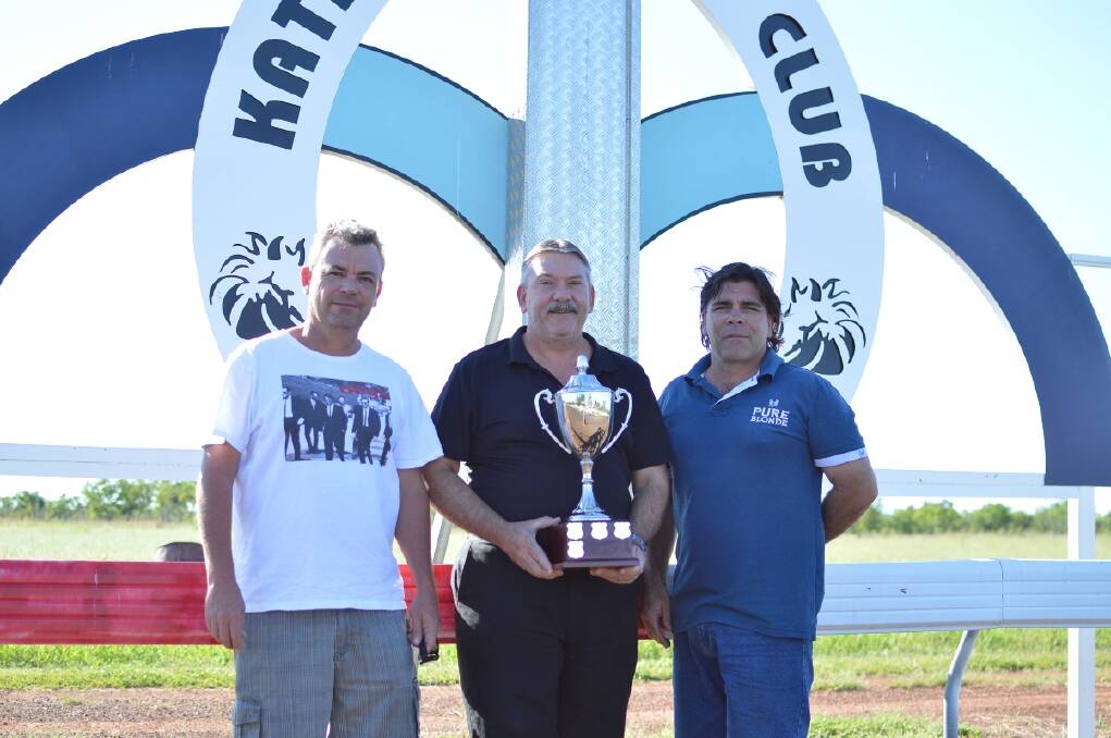 DATE SET: Thoroughbred Racing Northern Territory chief steward David Hensler, Katherine Turf Club president Duane Barclay and Jason Vincent dust off the Katherine Cup ahead of the town’s annual race meeting on August 8. 