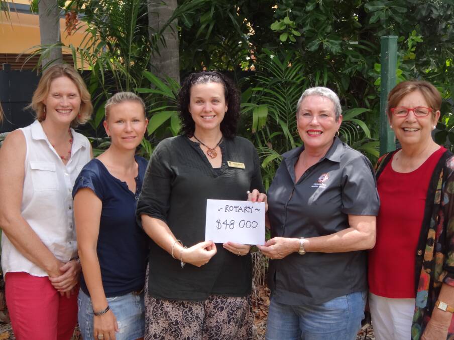COMMUNITY CANCER BOOST: Triple-0 Ball representatives Christine Sutherland, Anica Becket and Donna Bryant hand over a cheque for $48,000 to Katherine Cancer Working Group chair Toni Tapp-Coutts and deputy chair Val Dyer.
