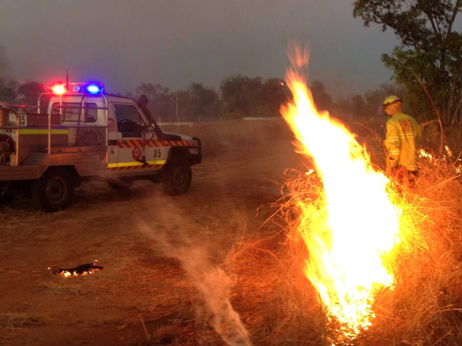 FIERY PREPARATION: Firefighters carry out a fuel reduction burn at the Katherine Showground on Thursday evening ahead of Territory Day celebrations.