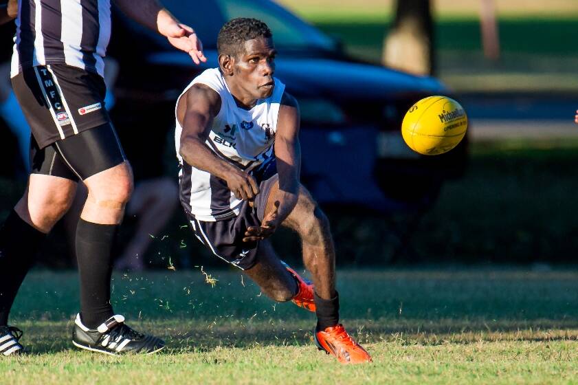 New recruit Leon George gets a handball away for the Tindal Magpies at RAAF Base Tindal on Saturday afternoon. Photo: CASEY BISHOP