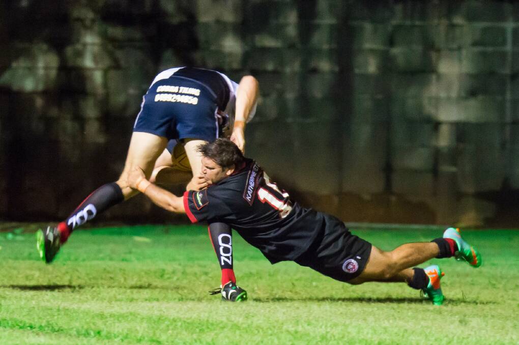 GOT HIM: Shannon Toby executes a big tackle for the Katherine Pirates during the team's representative clash against the Darwin-based University Pirates on February 21. Photo: CASEY BISHOP