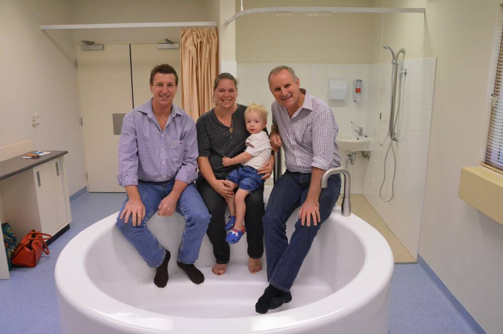 BABY BOOST: Member for Katherine Willem Westra van Holthe, Mellyssa and Mason Tracey, and Health Minister John Elferink check out the new birthing bath at Katherine Hospital on July 17.