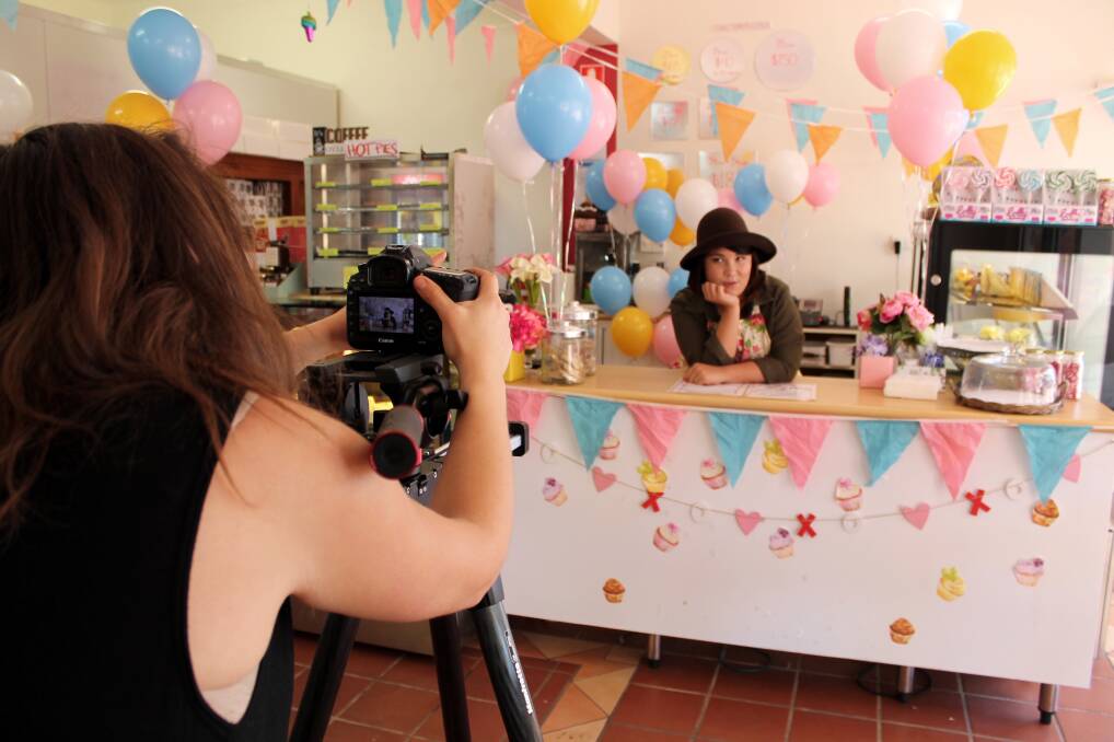 TASTY TUNE: Singer-songwriter Serina Pech owns The Sweetest Things counter during a music video shoot for her song “Sugar Muffin” on July 15.