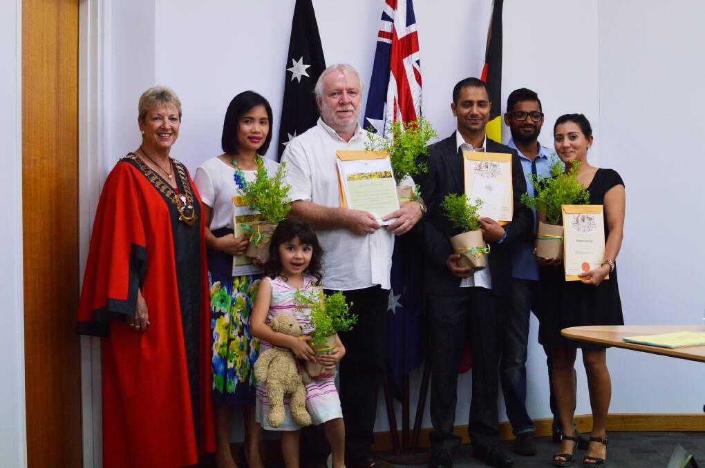 NEW FRIENDS: Katherine Town Council mayor Fay Miller congratulates the town’s newest Australian citizens on February 24.
