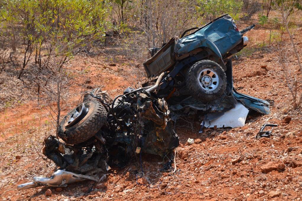 GRAPHIC WARNING: The mangled remains of the Toyota HiLux that was destroyed after it became stuck on a railway track and hit by a 7100-tonne manganese train on Sunday morning.