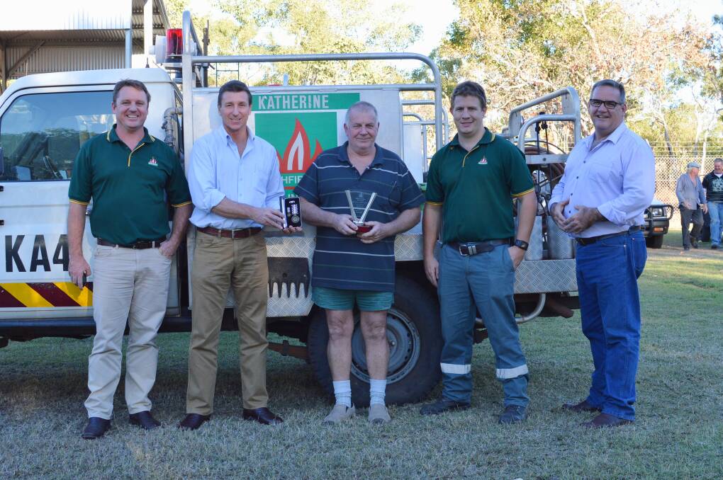FOND FAREWELL: Bob White, middle, was farewelled with a bang by more than 35 friends and firefighting colleagues at Katherine Volunteer Bushfire Brigade headquarters on July 14.