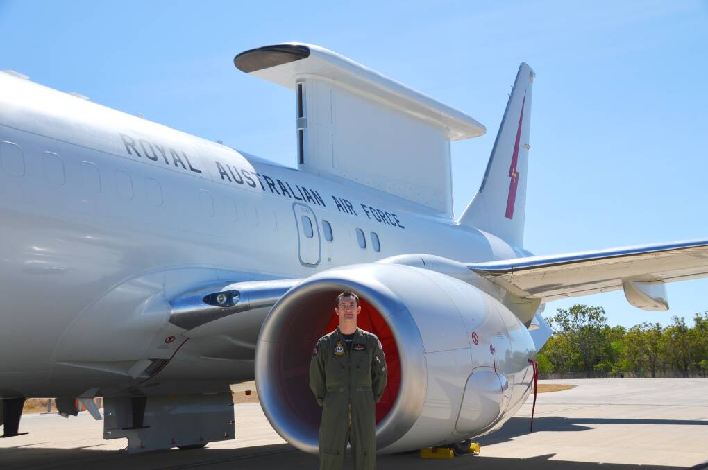 AIRBORNE PRESENCE: Squadron Leader Glenn Salmon shows off the E-7A Wedgetail on the tarmac at RAAF Base Tindal during Exercise Talisman Sabre.