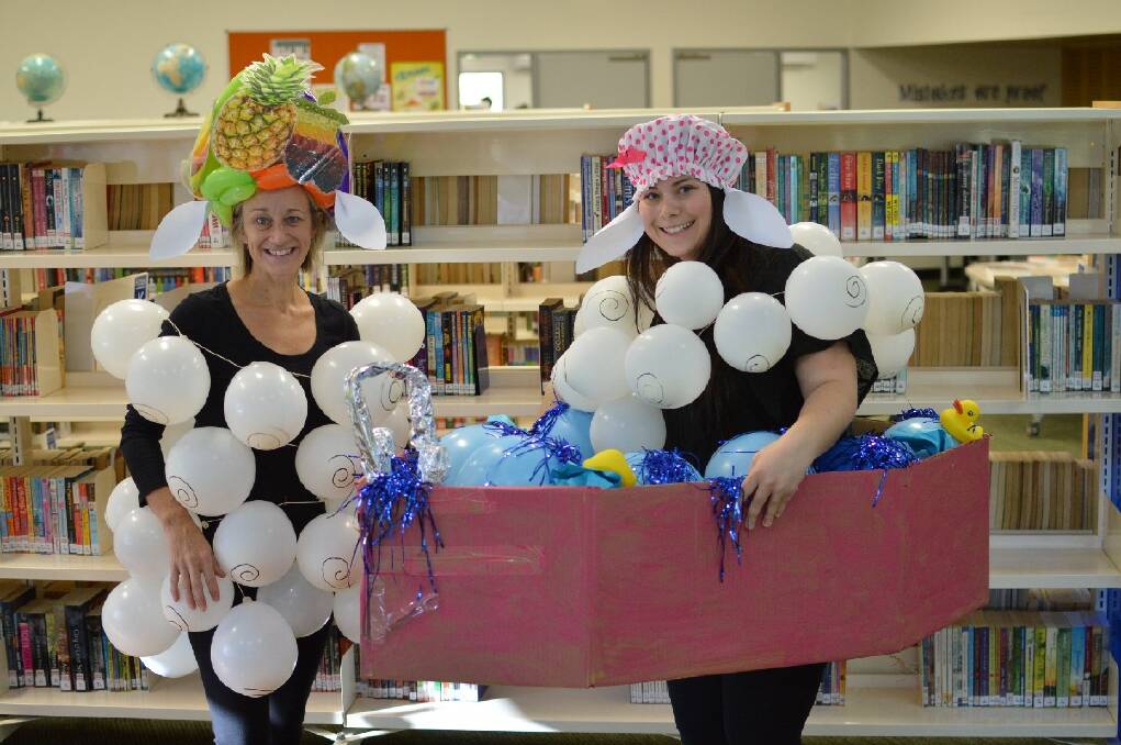 LIBRARY LAUGHS: Library staff Kellie Hoffman and Sophie Maloney get into the Book Week spirit.