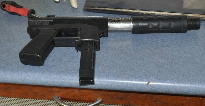 Another prohibted weapon - a pellet gun - police located durign the execution of the search warrant.