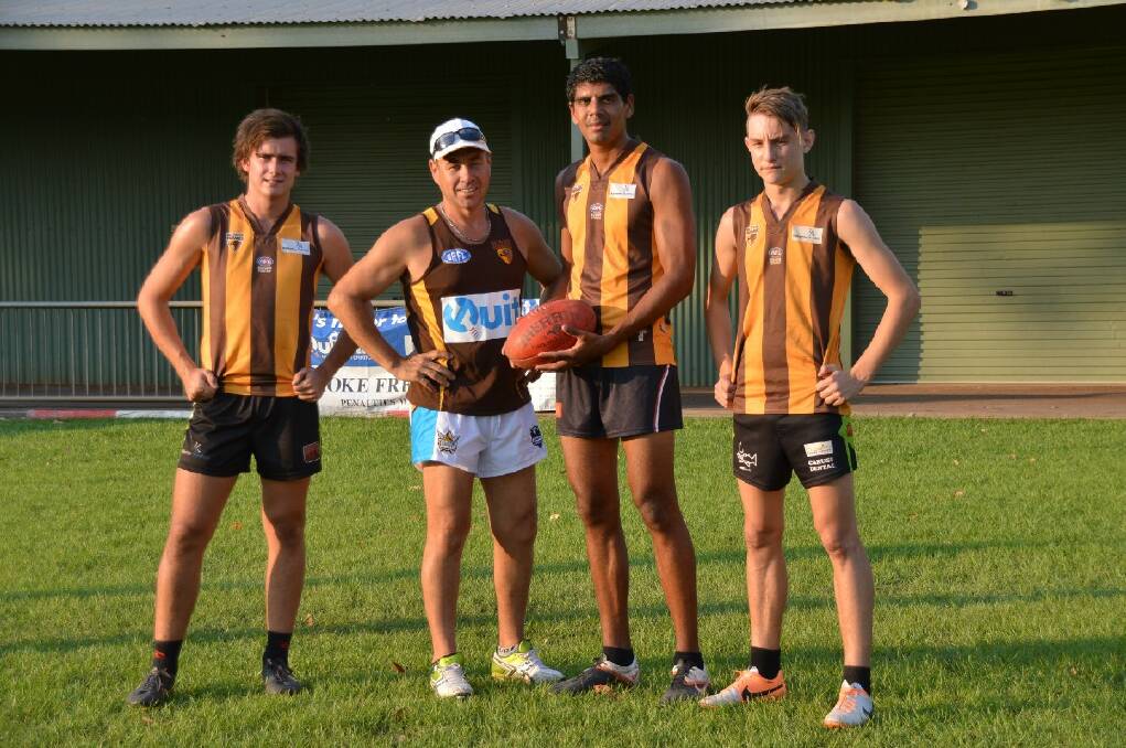 READY TO ROLL: Riley Sullivan, coach Andy Bilske, Devin Lines and Jordan Gardner check out the Nitmiluk Oval playing surface ahead of Saturday’s clash between the Big River Hawks and the Southern Districts Crocs.