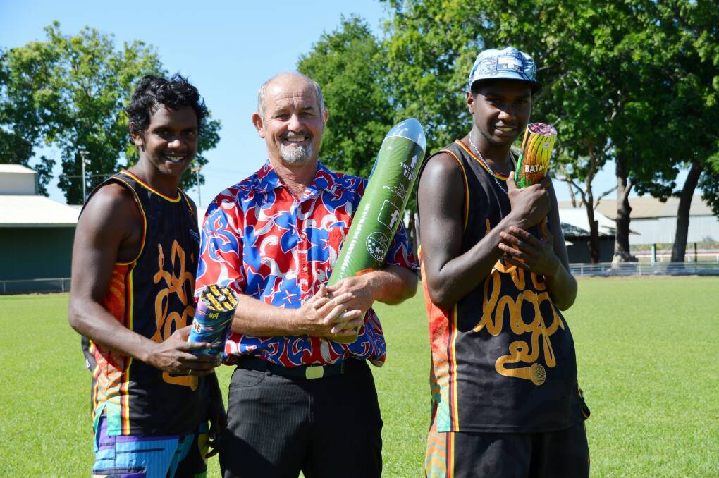 Aiden Lindsay, Katherine Town Council deputy Mayor Henry Higgins and Danzal Baker arm themselves with fireworks as they get into the Territory Day spirit.