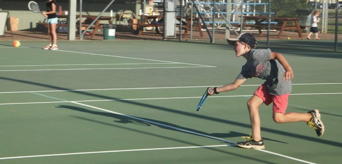 COURT CONTROL: Angus Cameron takes full advantage of the Katherine Tennis Club court during his team’s thrilling victory in the junior team competition on March 16.