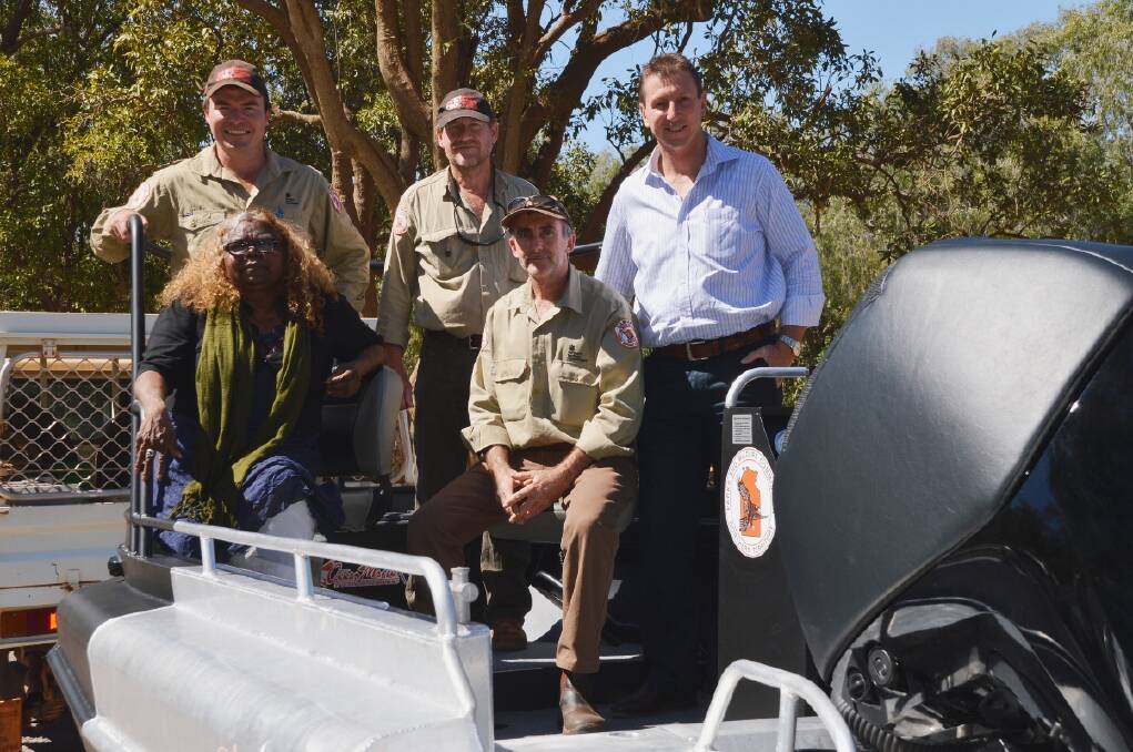 CROC CATCHER: Parks and Wildlife Minister Bess Price, rangers Joey Buckerfield, Chris Heydon and John Burke, and Member
for Katherine Willem Westra van Holthe inspect the new crocodile management boat, which Katherinites are being asked to name.